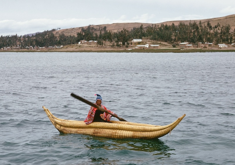 Fisherman in handmade reed boat on Lake Titicaca, Bolivia